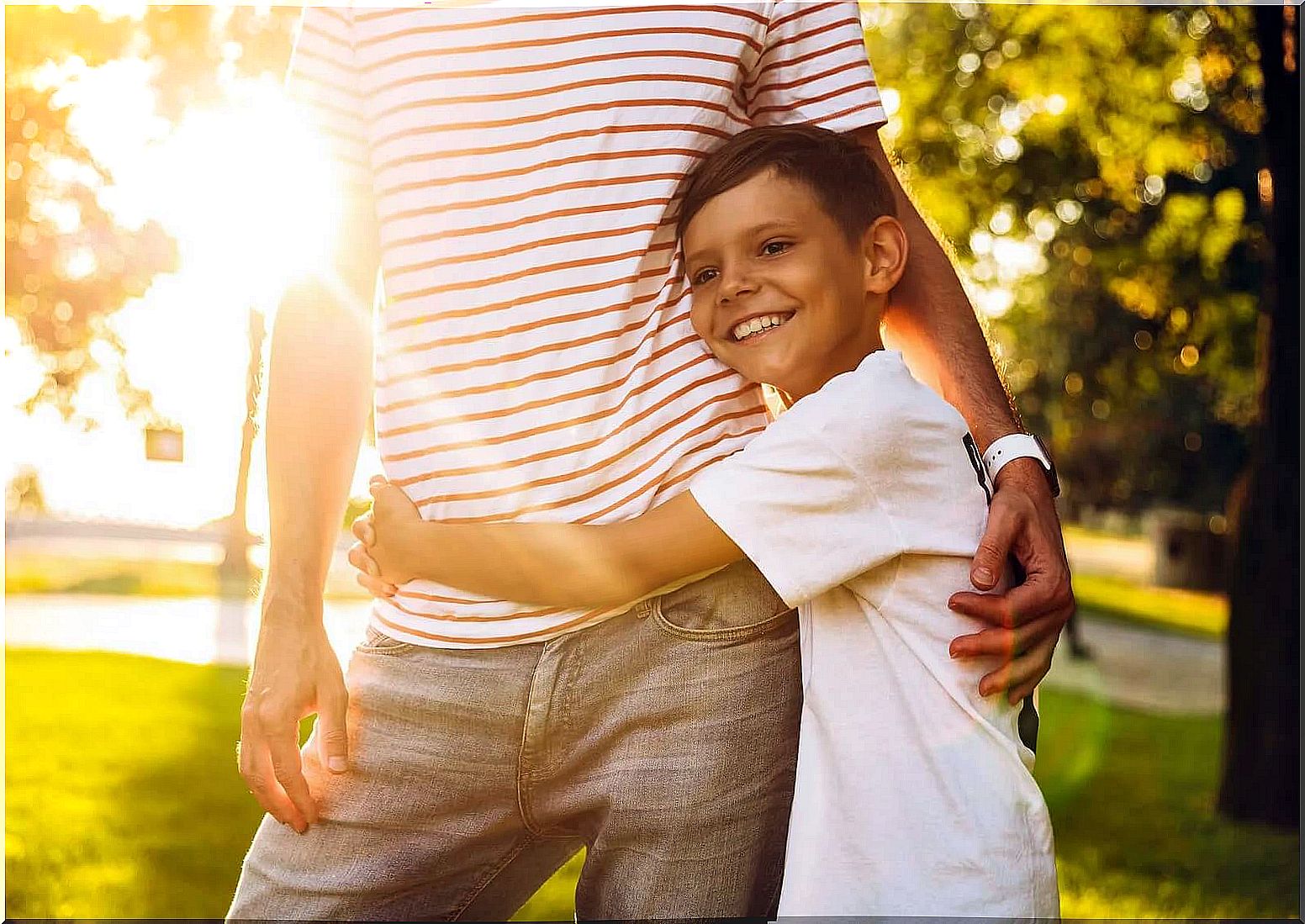 Boy hugging his father because he knows he can do things on his own.