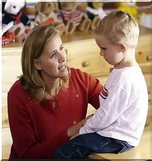 Mother talking to her son about tantrums.