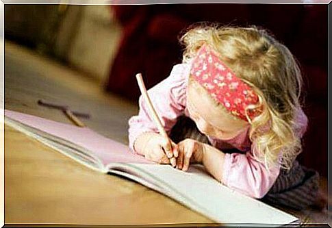 girl writing in her notebook