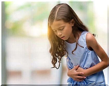 Girl showing that she has a stomachache