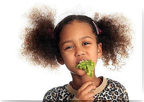 girl eating lettuce