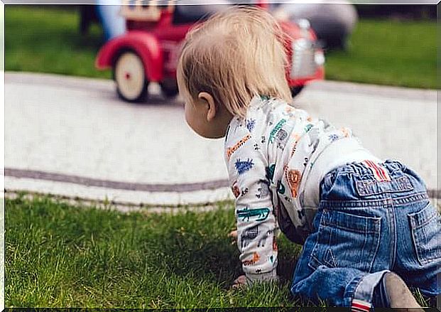 baby crawling on the grass