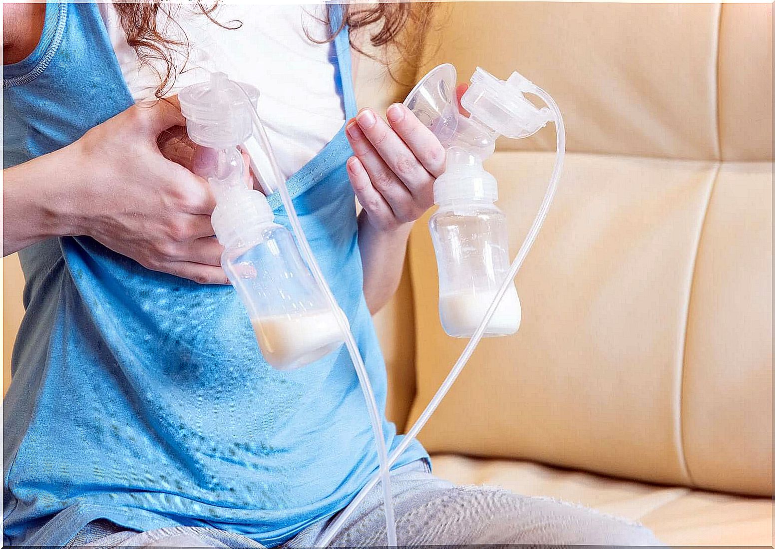 Woman using a double breast pump.